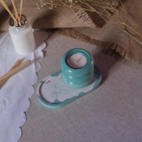 Support ovale marbré bleu scintillant + bougie cylindrique parfumée au thé noir